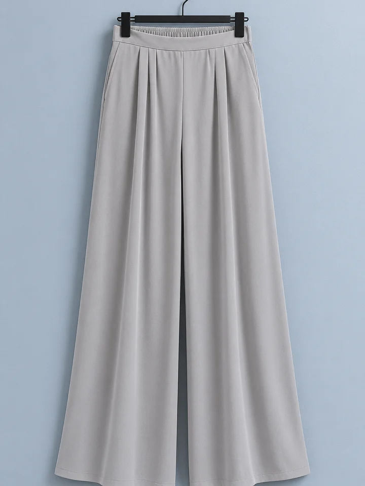 Palazzo fluido Ermitagaña, color gris perla, colgado en percha